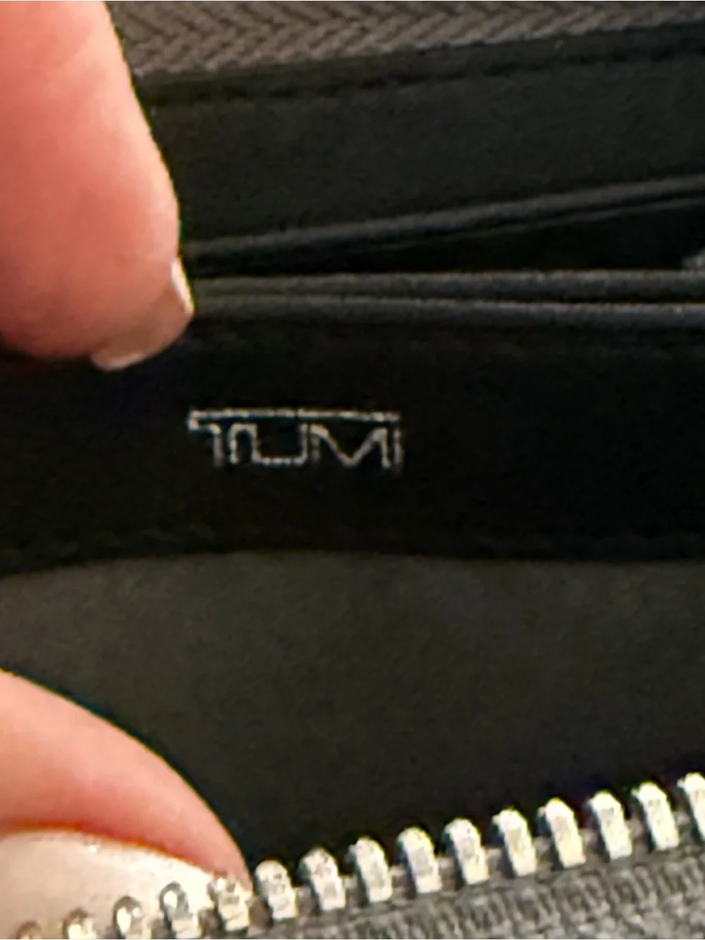 Tumi Gun Metal Wallet with Silver Logo and Zipper